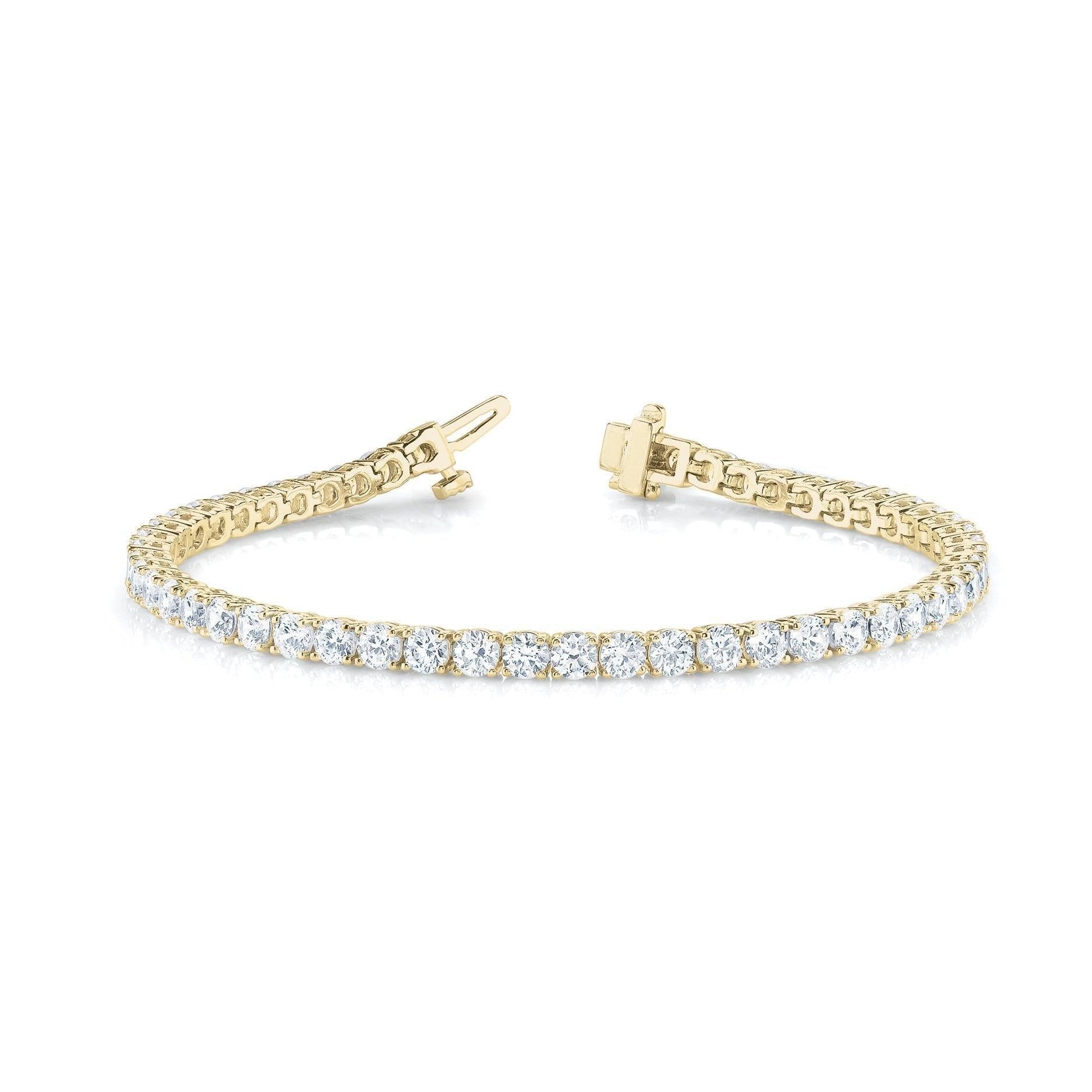 14K yellow gold four-prong diamond Tennis bracelet, with 2.5 to 8.0 in total carat weight of diamonds with an average H color and SI clarity diamonds.