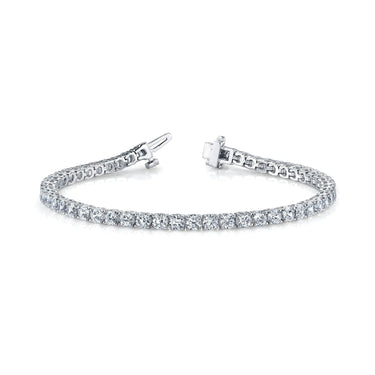 14K white gold four-prong diamond tennis bracelet with between 2.5 and 8.0  carats of total diamonds. Diamonds average H color and I clarity.