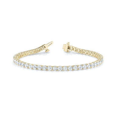 14K yellow gold four-prong diamond Tennis bracelet,  with 2.5 to 8.0 in total carat weight of diamonds with an average H color and SI clarity diamonds.